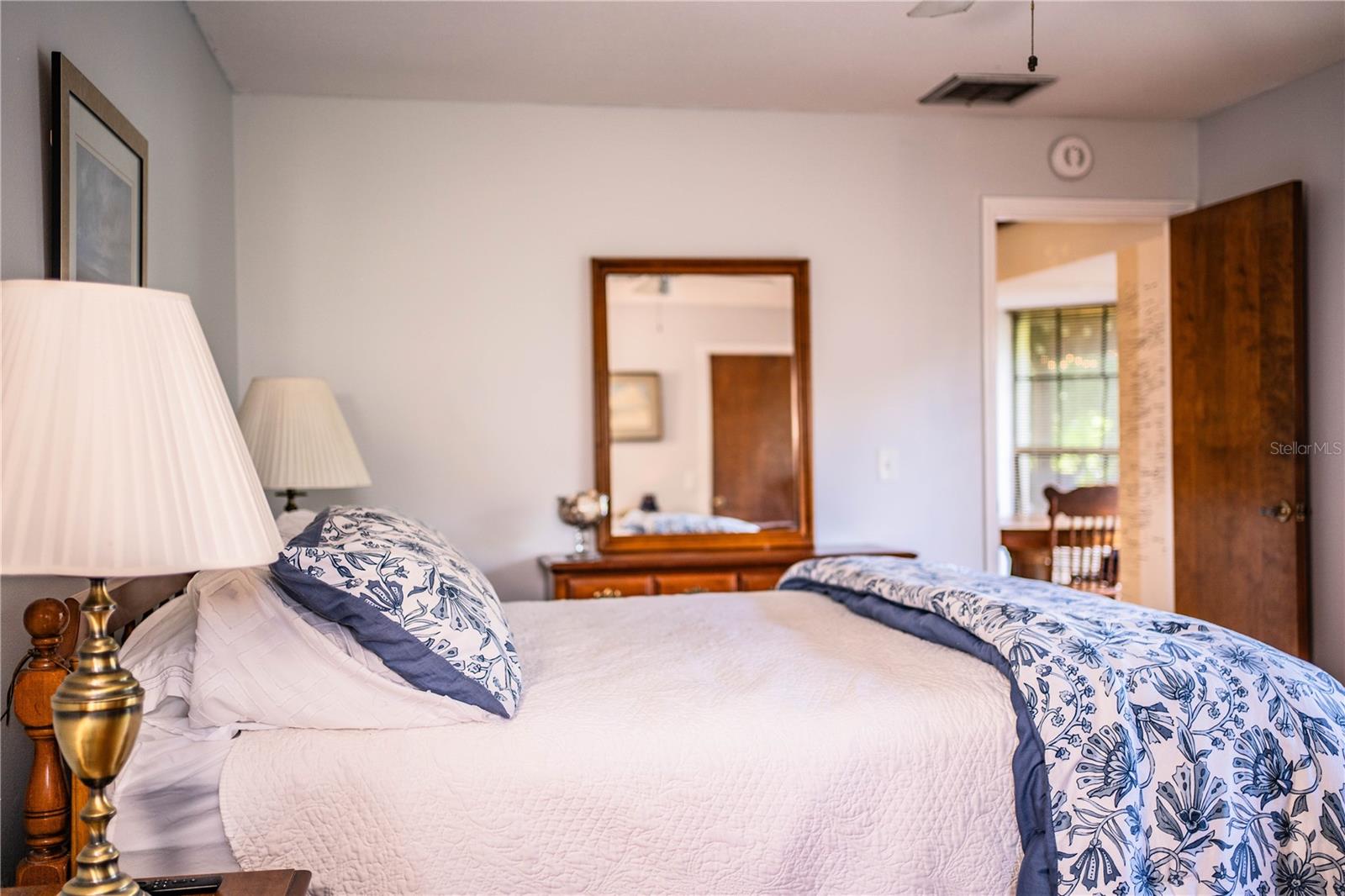Enjoy the convenience of a private en suite bathroom, making morning routines a breeze in this spacious primary bedroom.