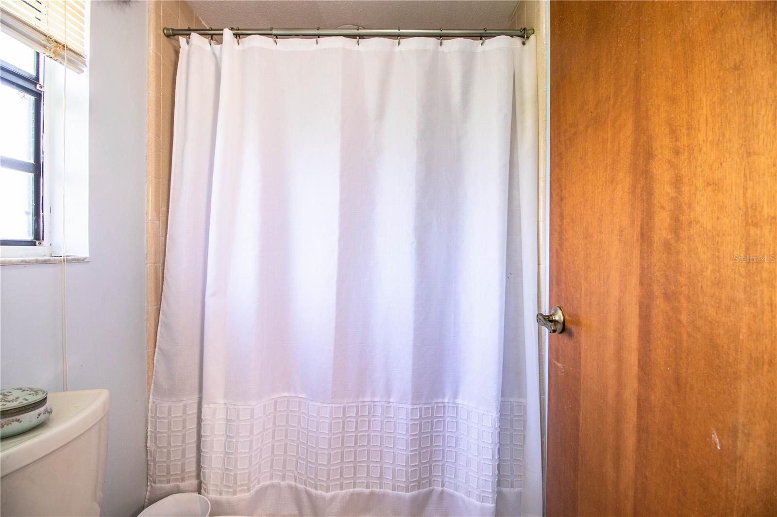 The en suite bath features a walk in shower!