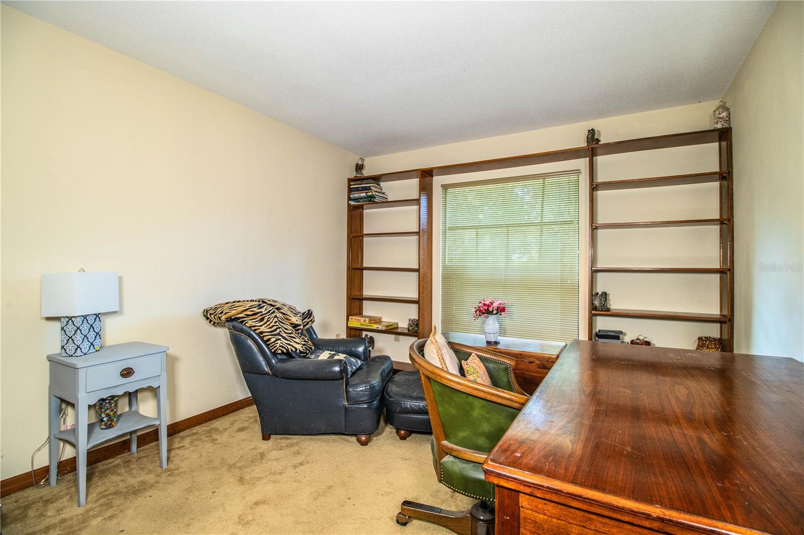 Bedroom 4 is versatile, with built-in shelving surrounding a large window—ideal for a home office or creative space.