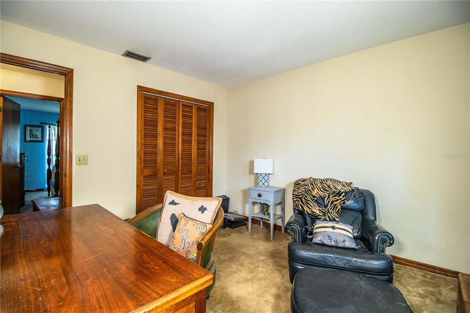 With built-ins, a large window, and plush carpeting, bedroom 4 would make a charming office, reading nook, or flex space.