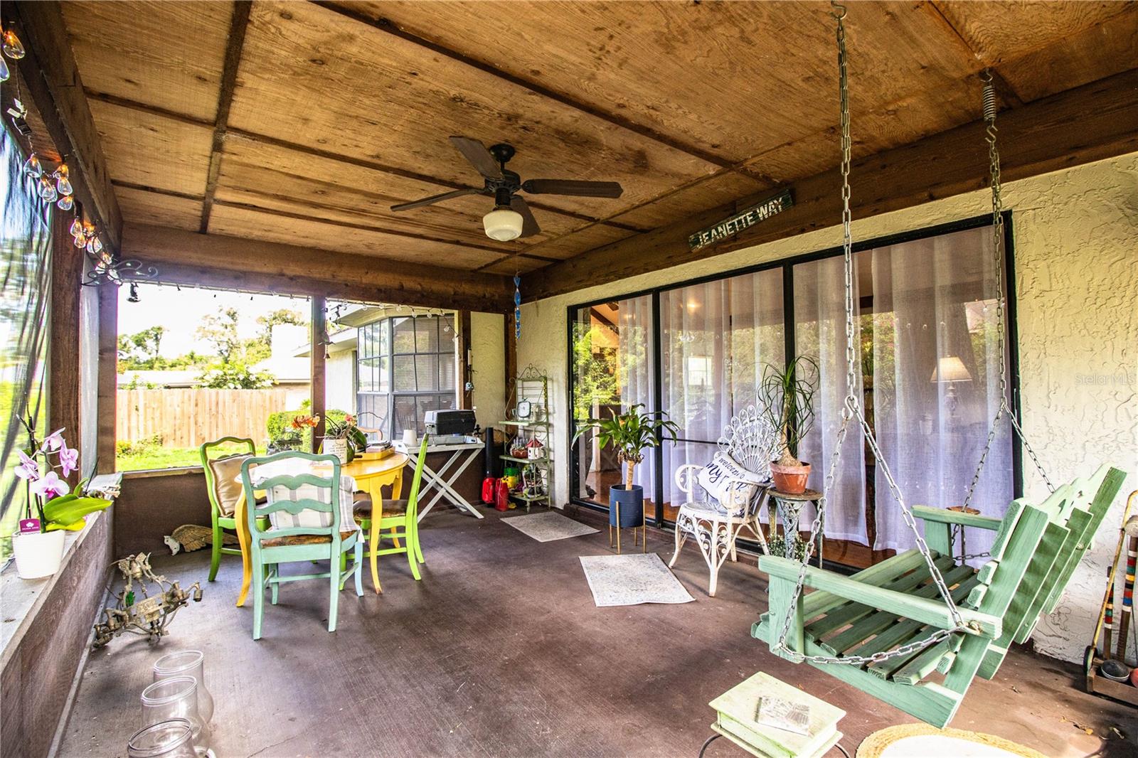 Step onto the large screened-in lanai, accessed through wide sliding glass panels, ideal for hosting guests or enjoying the Florida breeze.