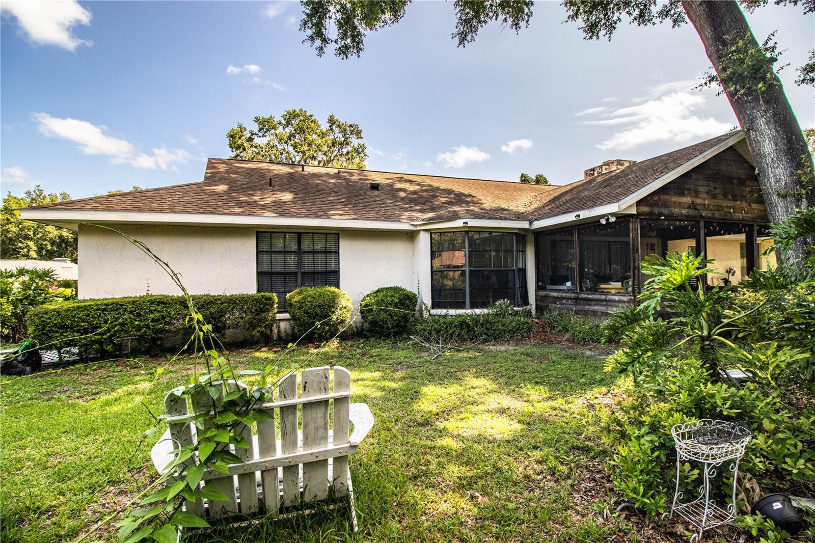 Enjoy the peaceful surroundings of a large, landscaped backyard—ideal for outdoor living, gardening, or play.