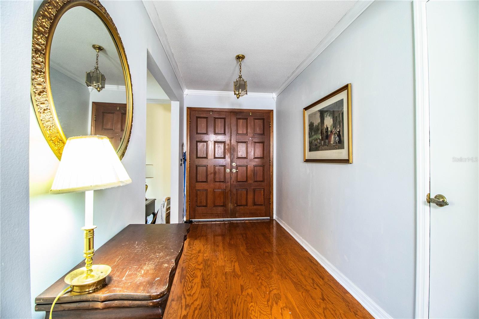 A warm welcome from the front door leads into an inviting living space and nearby family room.