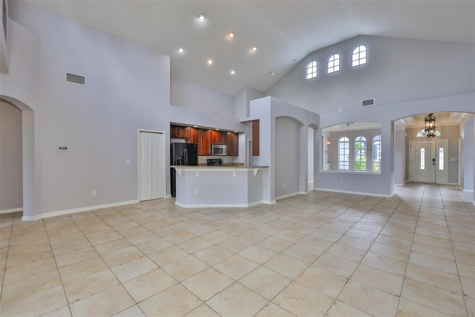 Left to bath 2, bedrooms 2 and 3, ahead pantry, dinette, breakfast bar looking to foyer and dining room