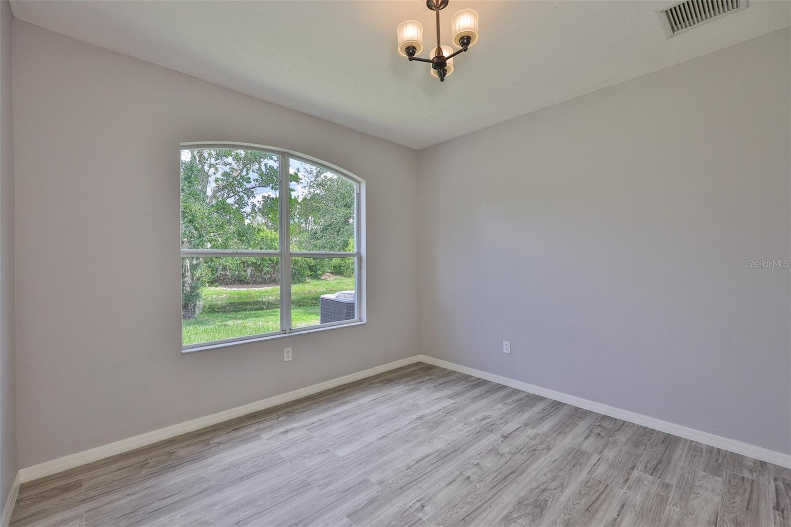 Bedroom 2, water view, walk-in closet and new vinyl plank flooring