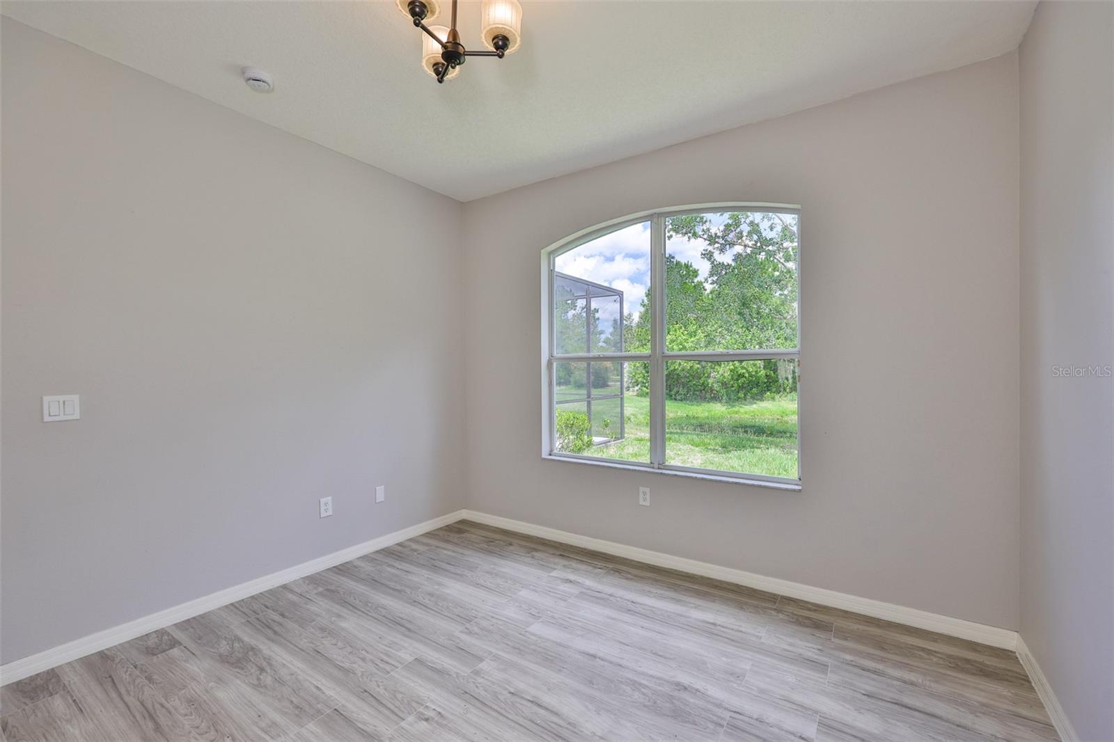 Bedroom 2, water view, walk-in closet and new vinyl plank flooring