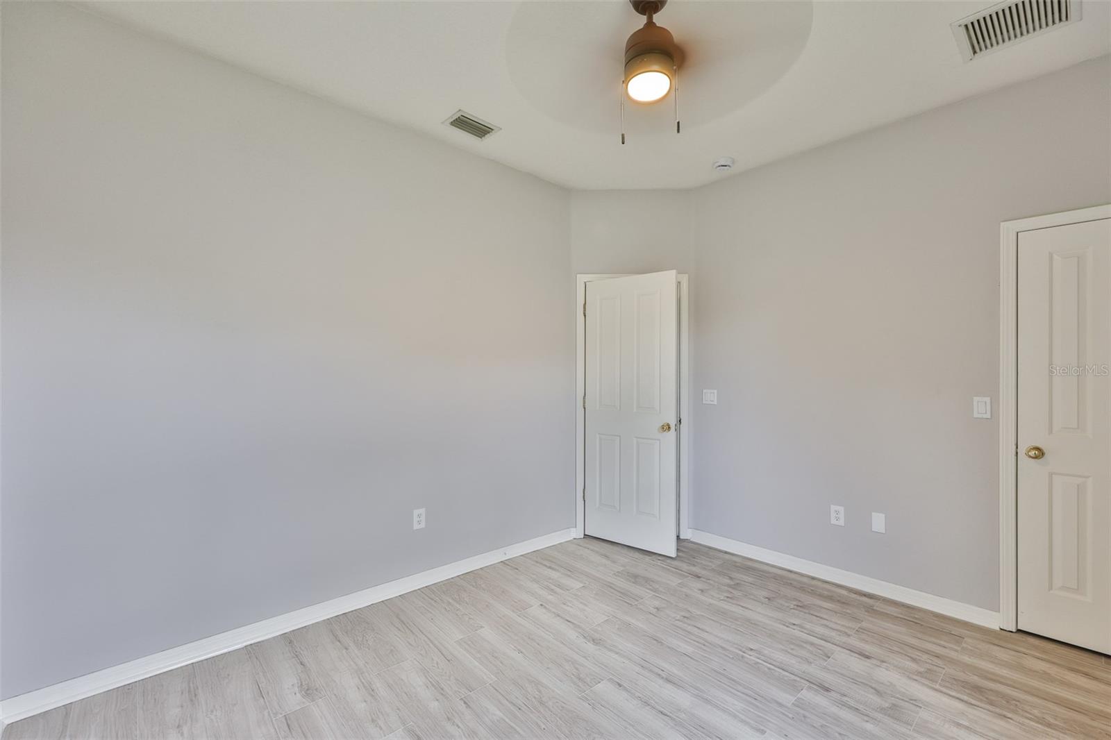 Bedroom 3, new ceiling fan, walk-in closet and new vinyl plank flooring