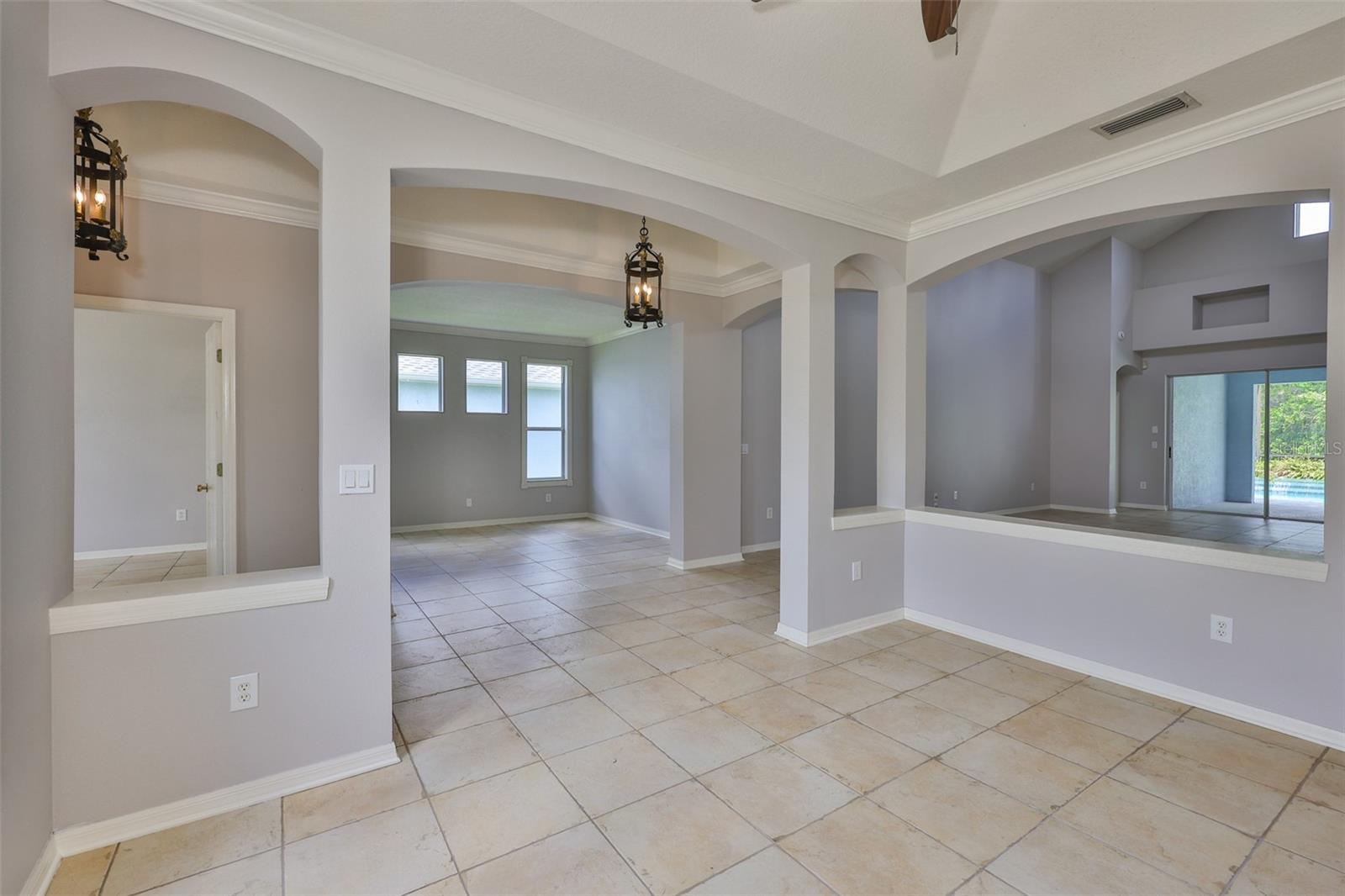 Study/den with window wall - from dining room and foyer with trey ceilings
