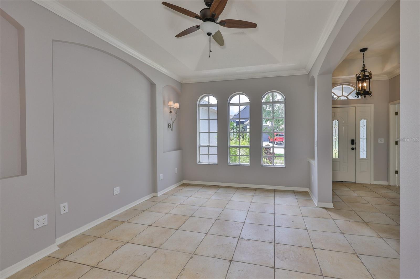 Dining room window wall and front door and sidelight with leaded glass