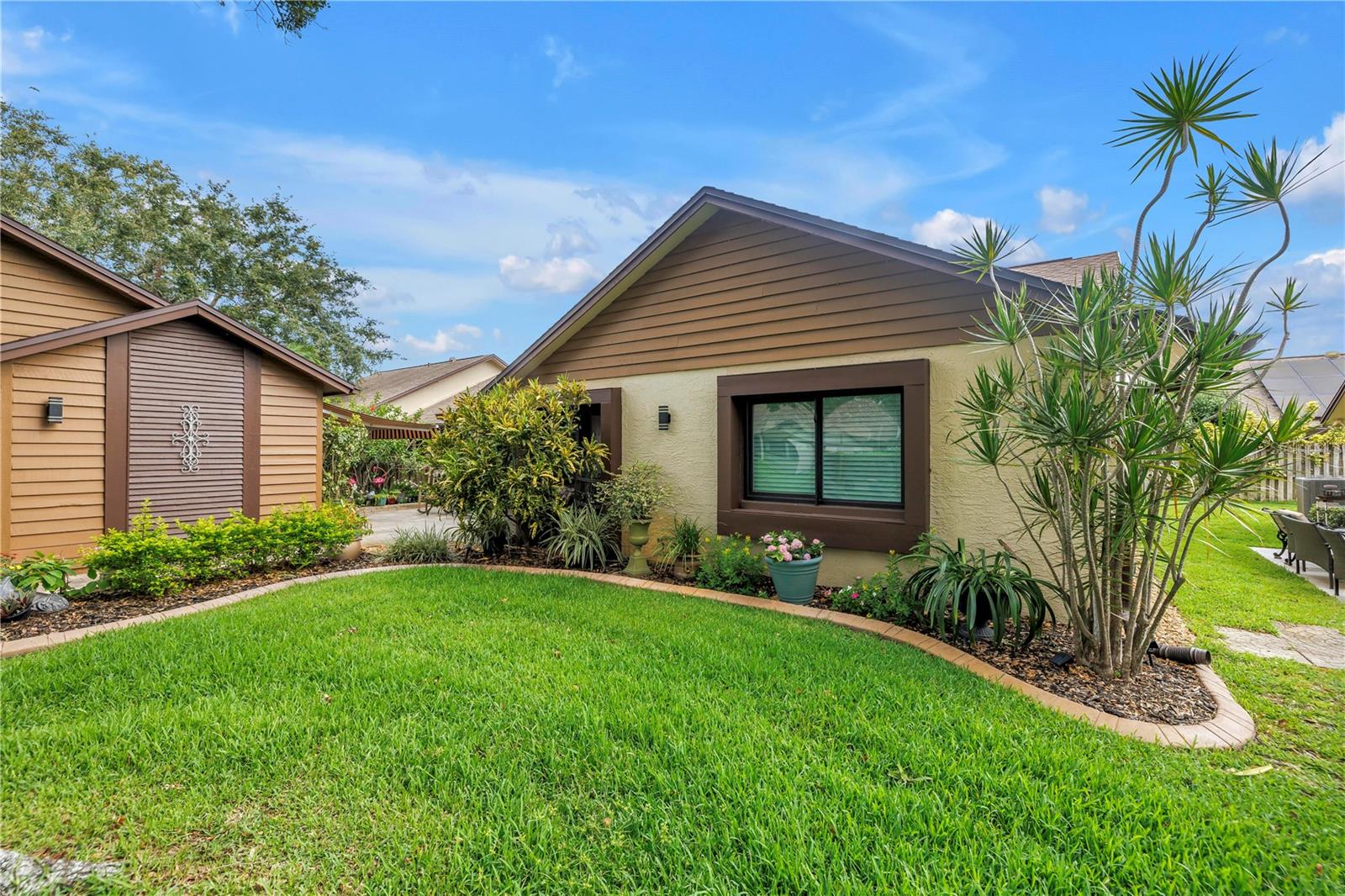 Front Exterior With Beautiful Gardens