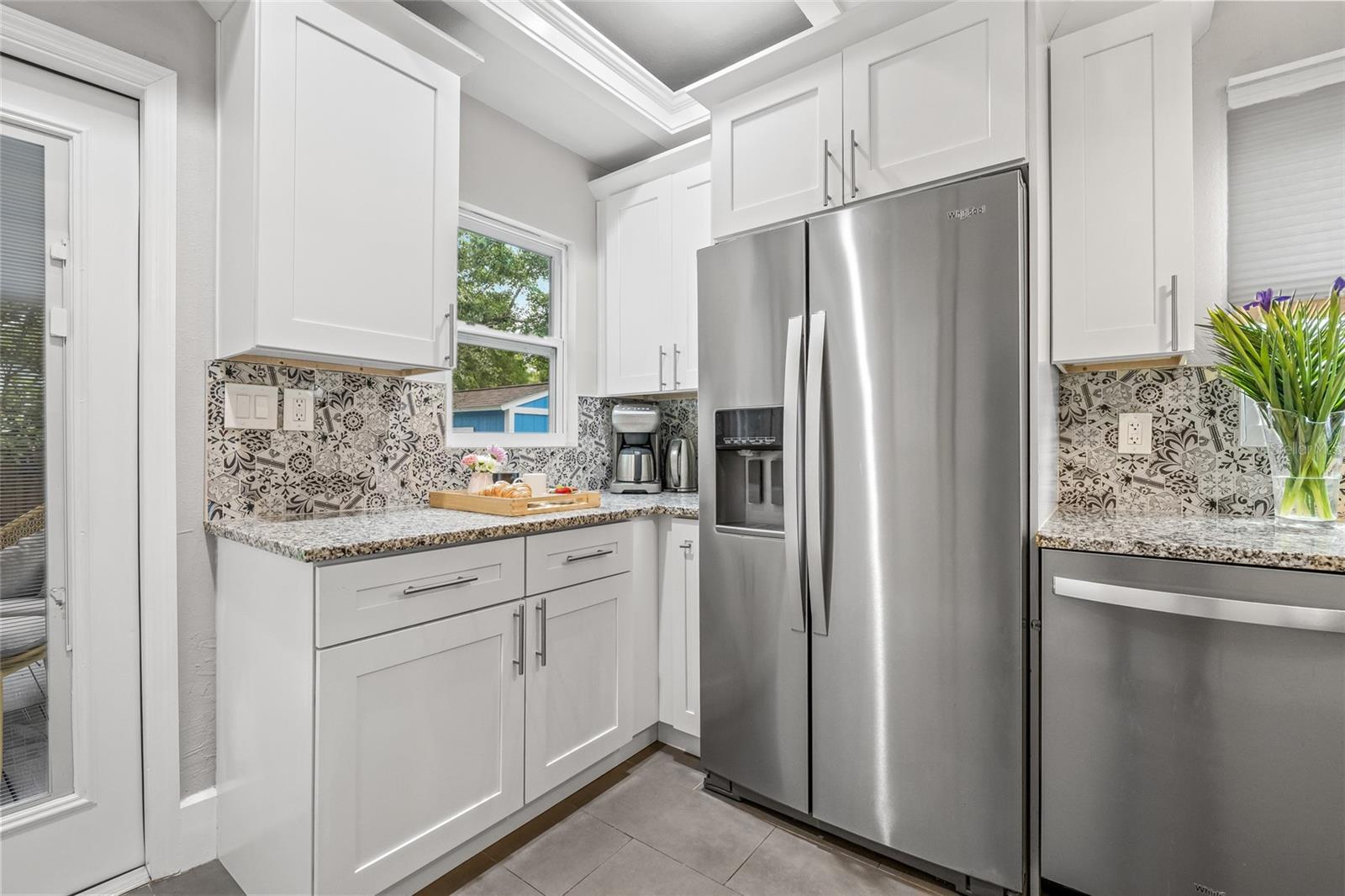 Cozy corner setup is perfect for a coffee bar or prep area, with a view of the backyard.