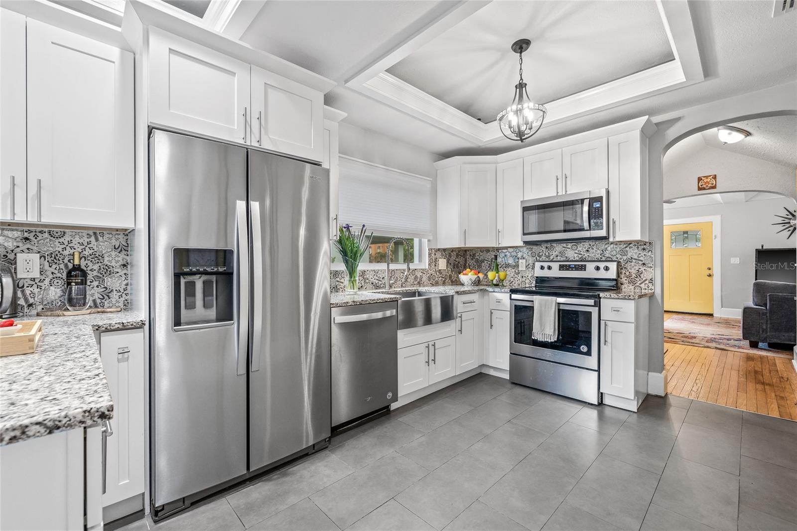 Equipped with a full suite of stainless steel appliances and ample counter space—ideal for everyday cooking or entertaining.