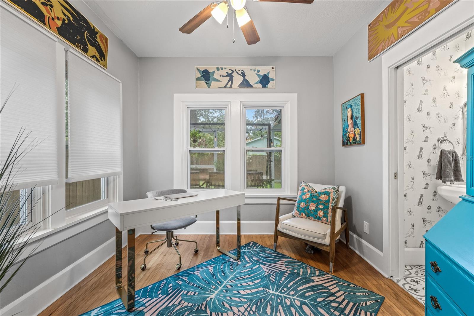 This bright and versatile room, currently used as a home office, has large windows and also can be perfect for a reading nook or creative space.