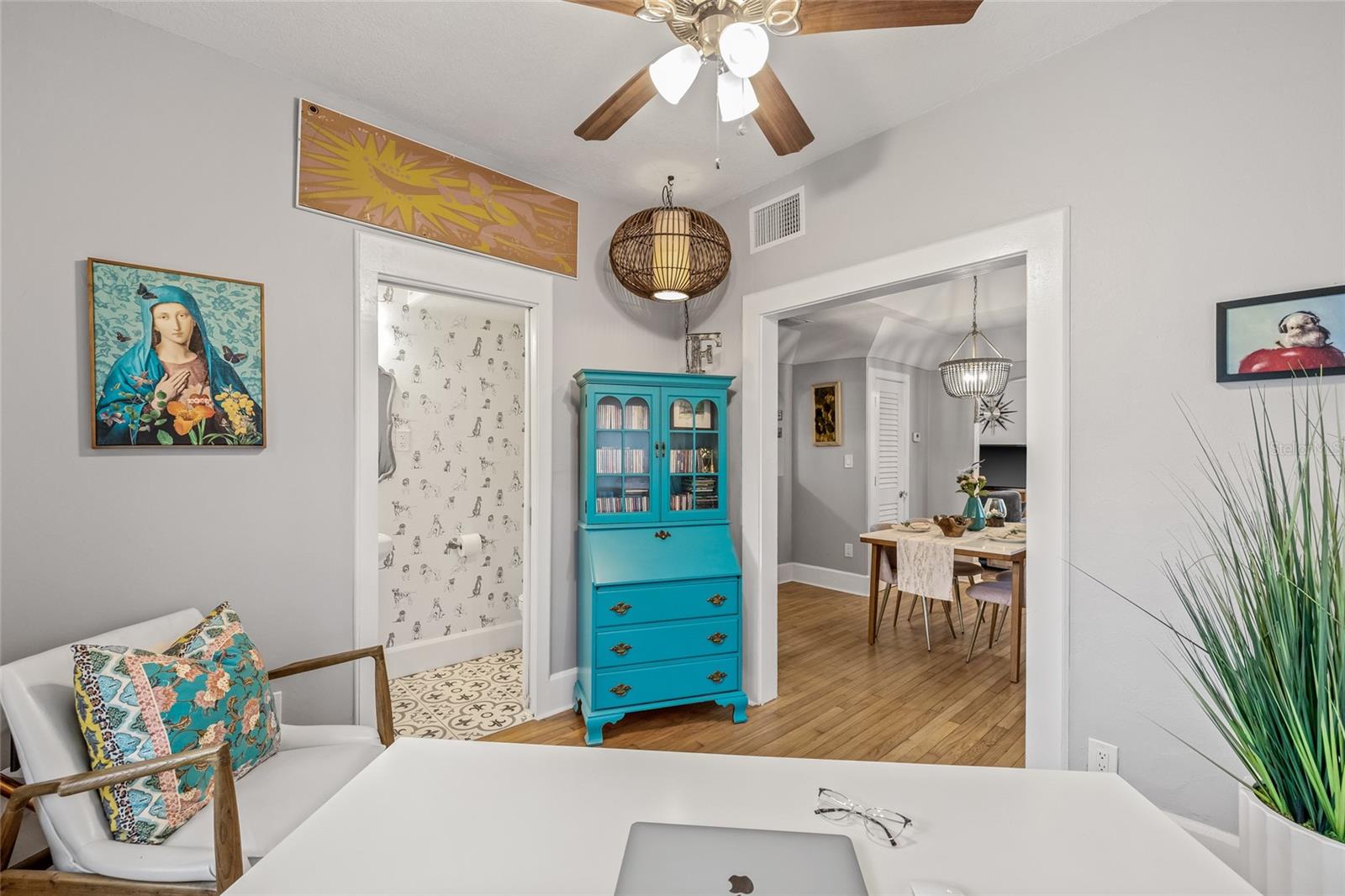 Conveniently located off the dining room, this stylish space offers direct access to a uniquely appointed half bath on the main floor.