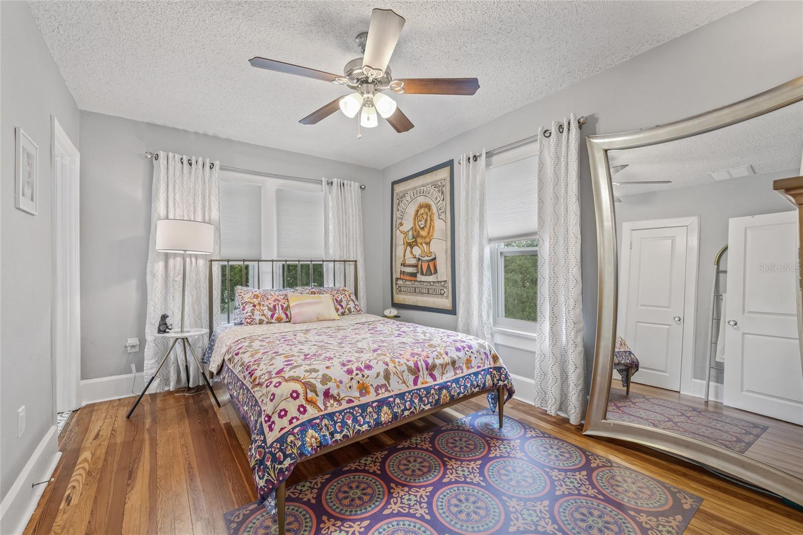 The spacious primary bedroom with ensuite, has generous windows, and room for a king-sized bed.
