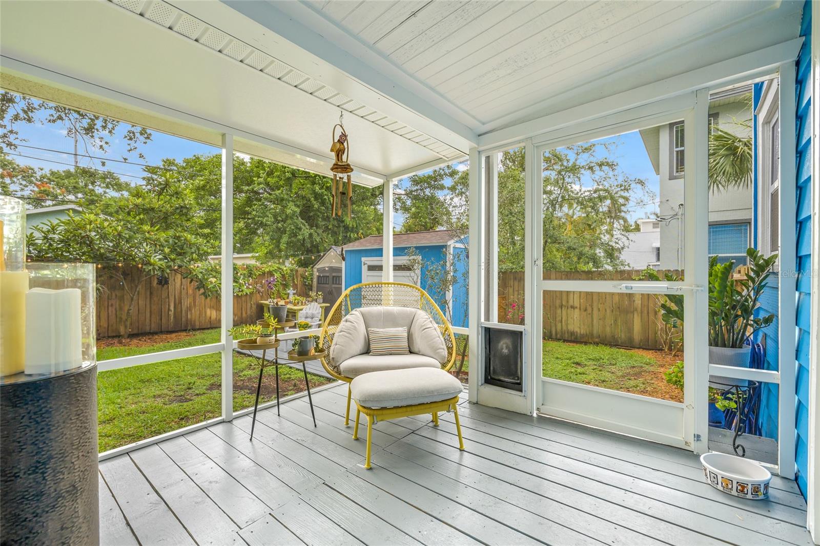 Covered porch offers the perfect blend of comfort and fresh air for morning coffee or evening cocktails.