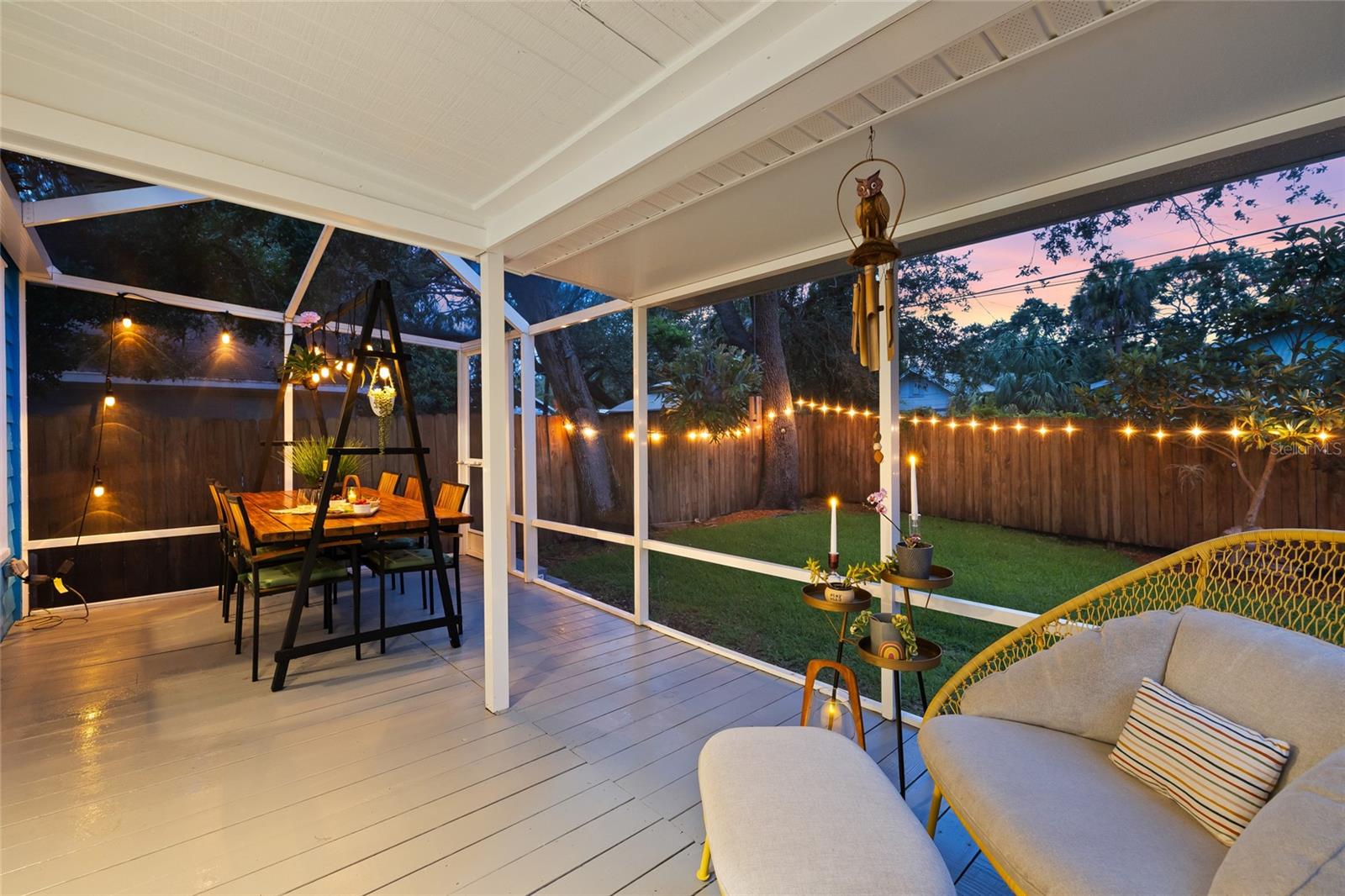 Enjoy serene evenings on the screened porch, surrounded by peaceful views of the your lush backyard.
