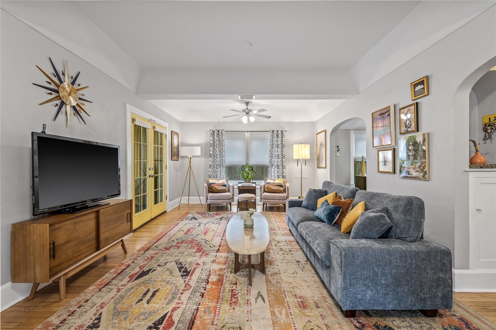 The living area comfortably accommodates multiple seating areas for homeowners and guests alike.