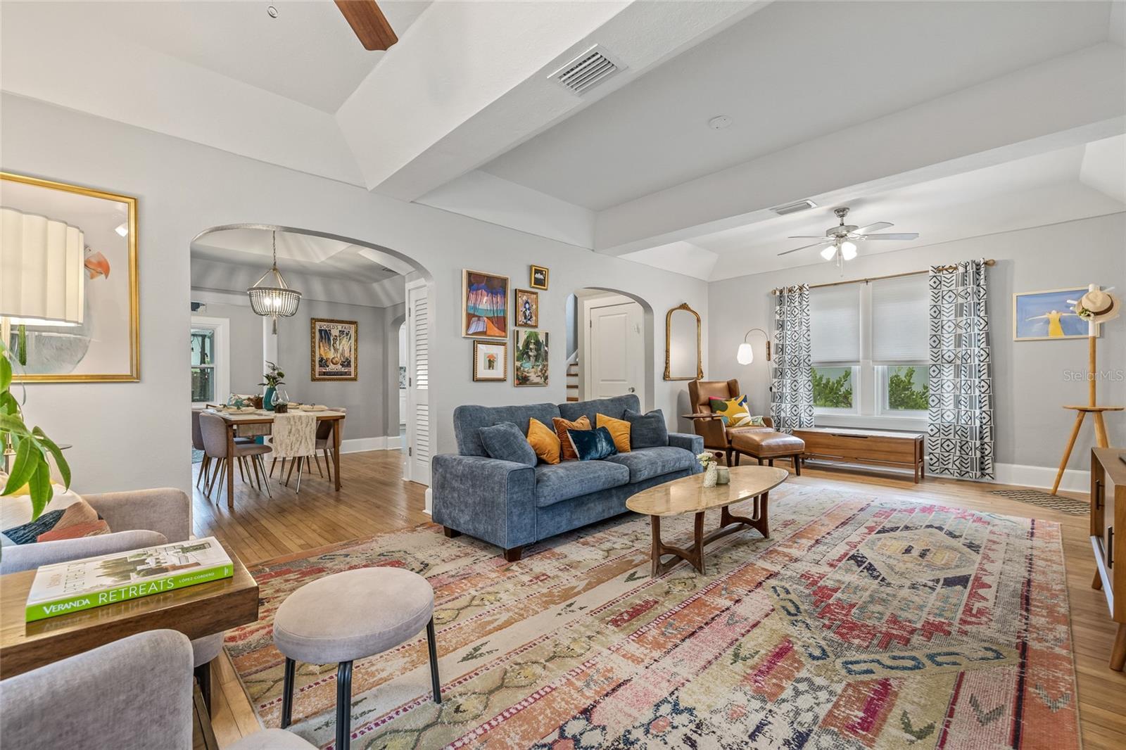Charming archways to the dining room and kitchen provide wonderful flow to all other spaces in the home.