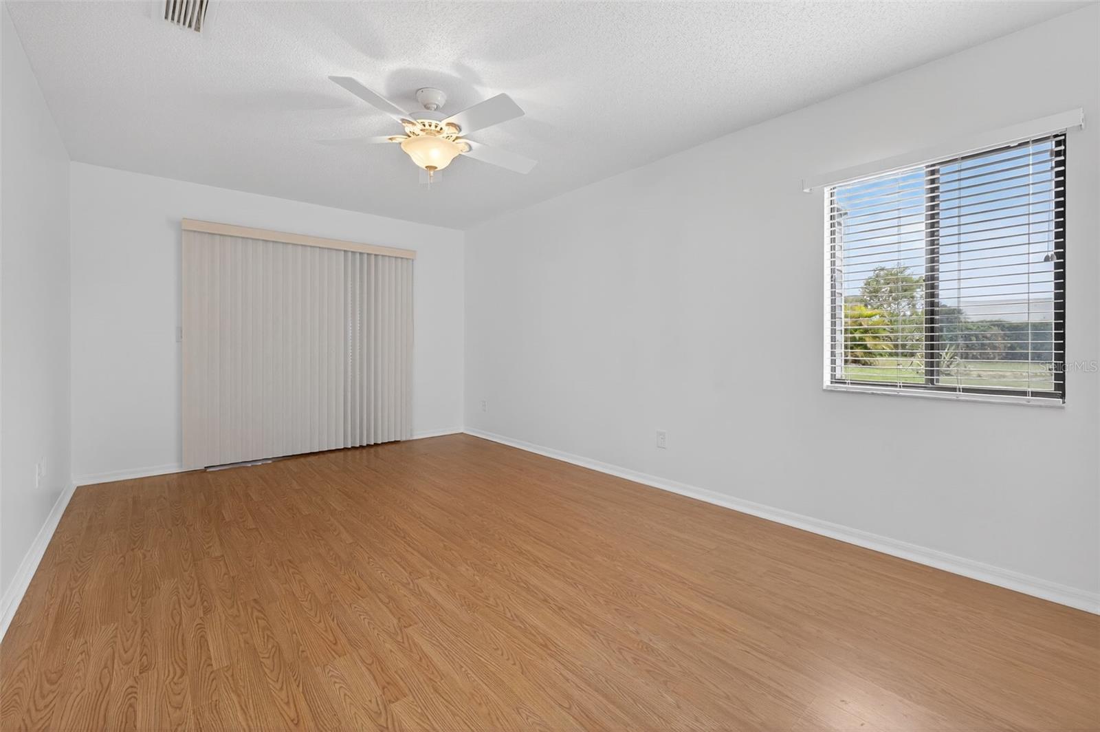 Second Bedroom with sliding glass doors