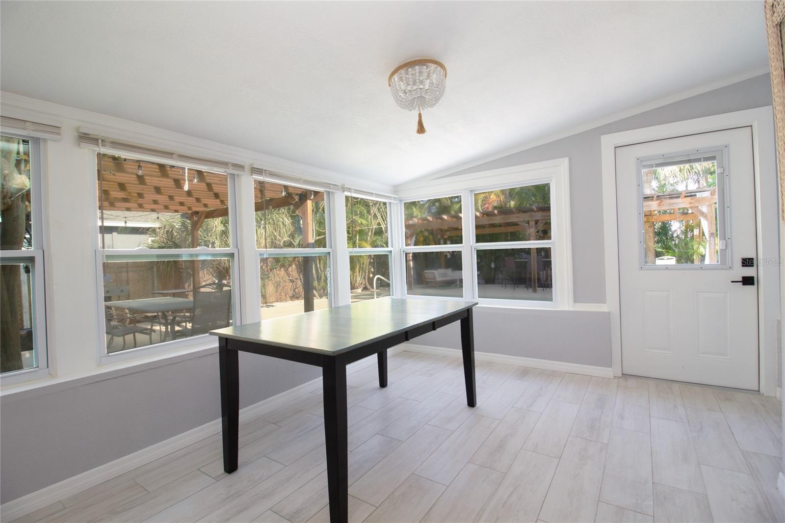 Large dining area looking out to pool