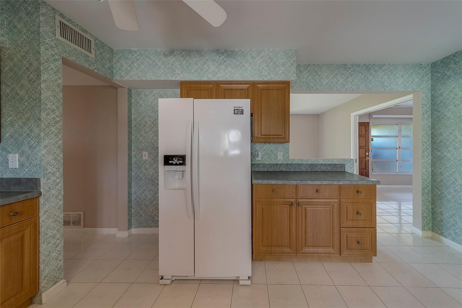 Refrigerator and additional cabinets