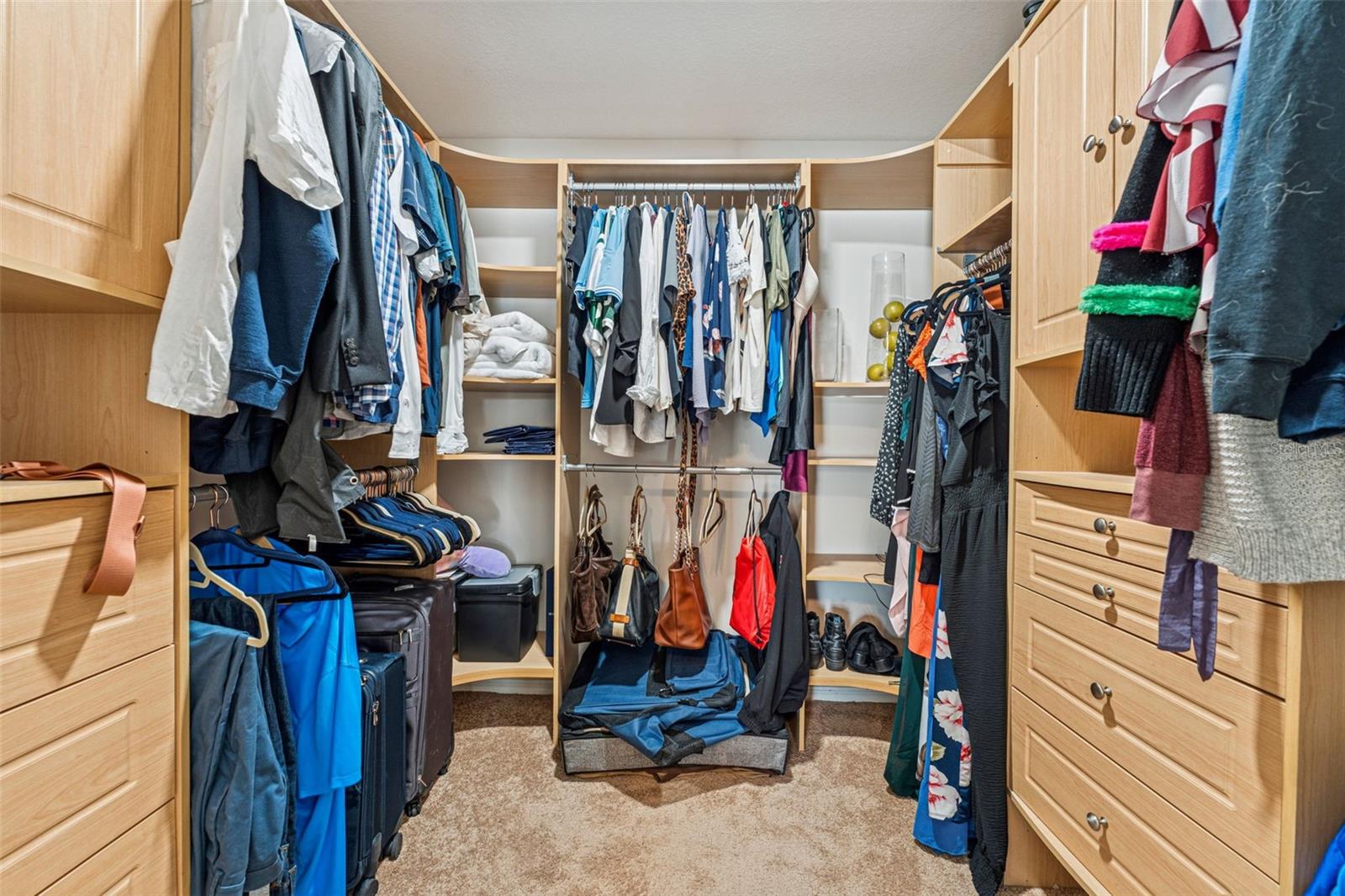 Primary Suite Walk-In Closet with High End Closet System