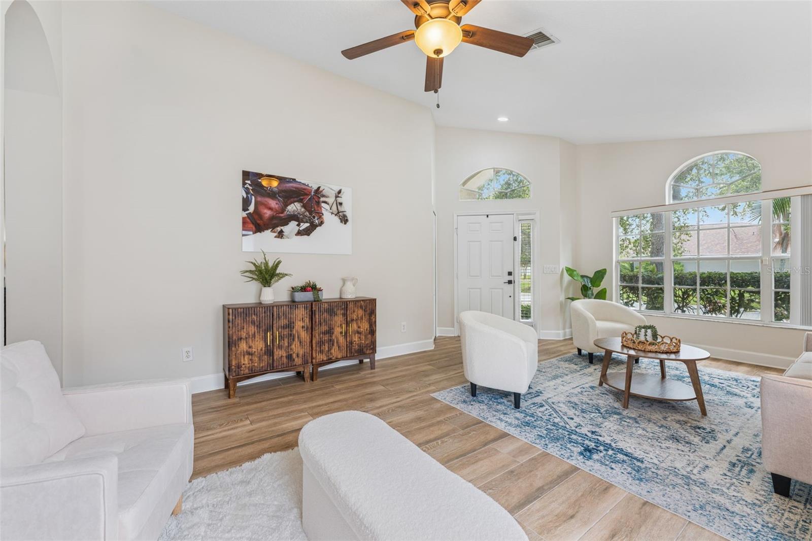 Natural light, high ceilings and warm, luxury wide plank flooring set the stage.