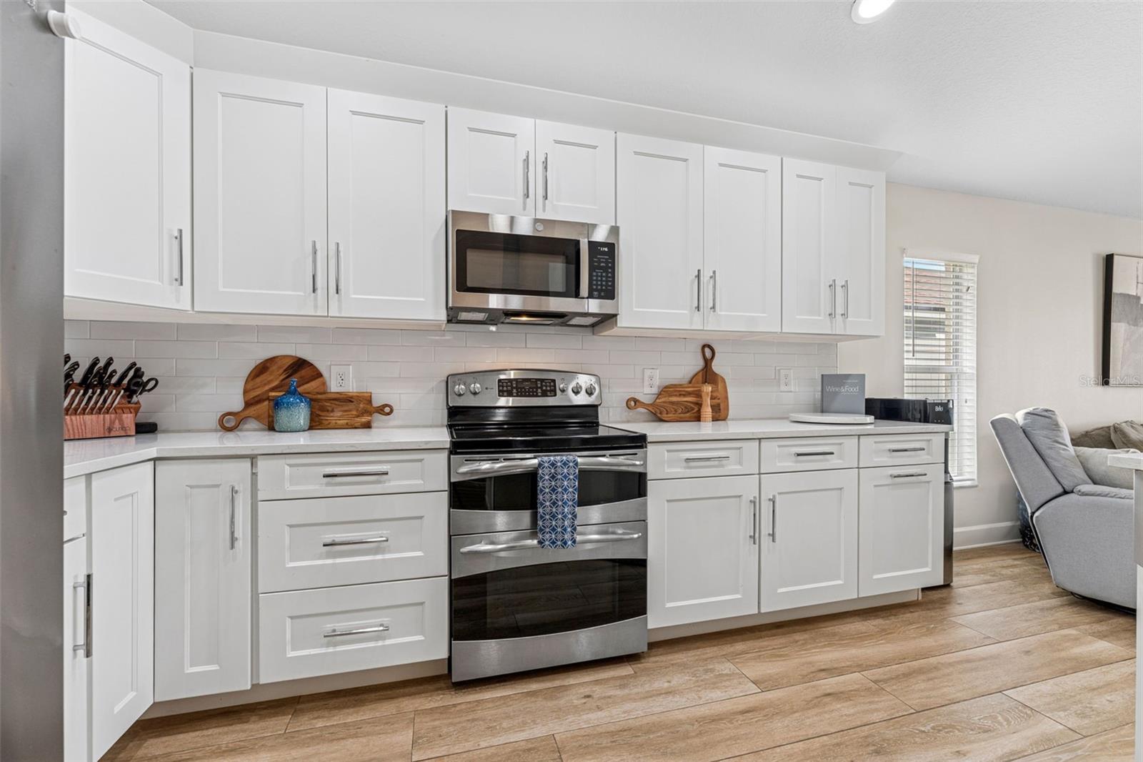 Quartz counters complimented by stainless steel appliances and plenty of storage!