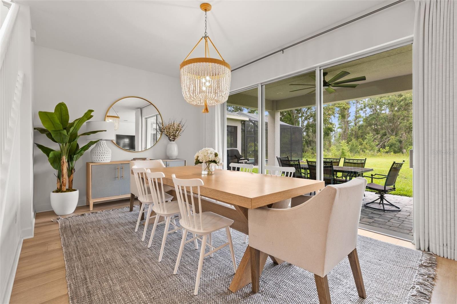 Dining room with one of two sliding galss doors to the paved coered patio