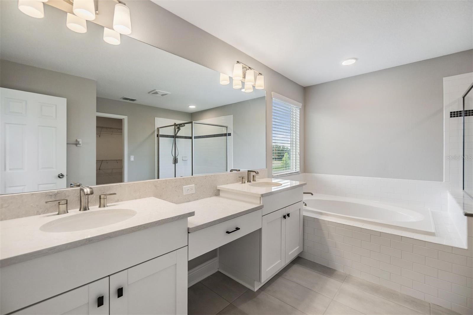 Dual Sinks with vanity, large soaking tub and walk-in shower