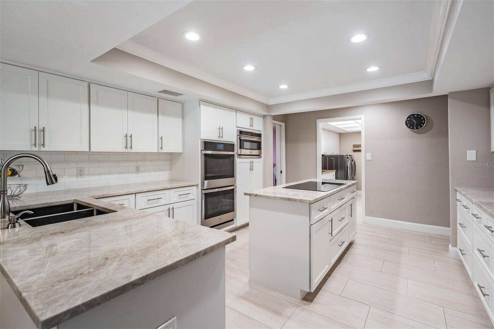 Spacious pantry with custom shelving for ease of organization and accessibility