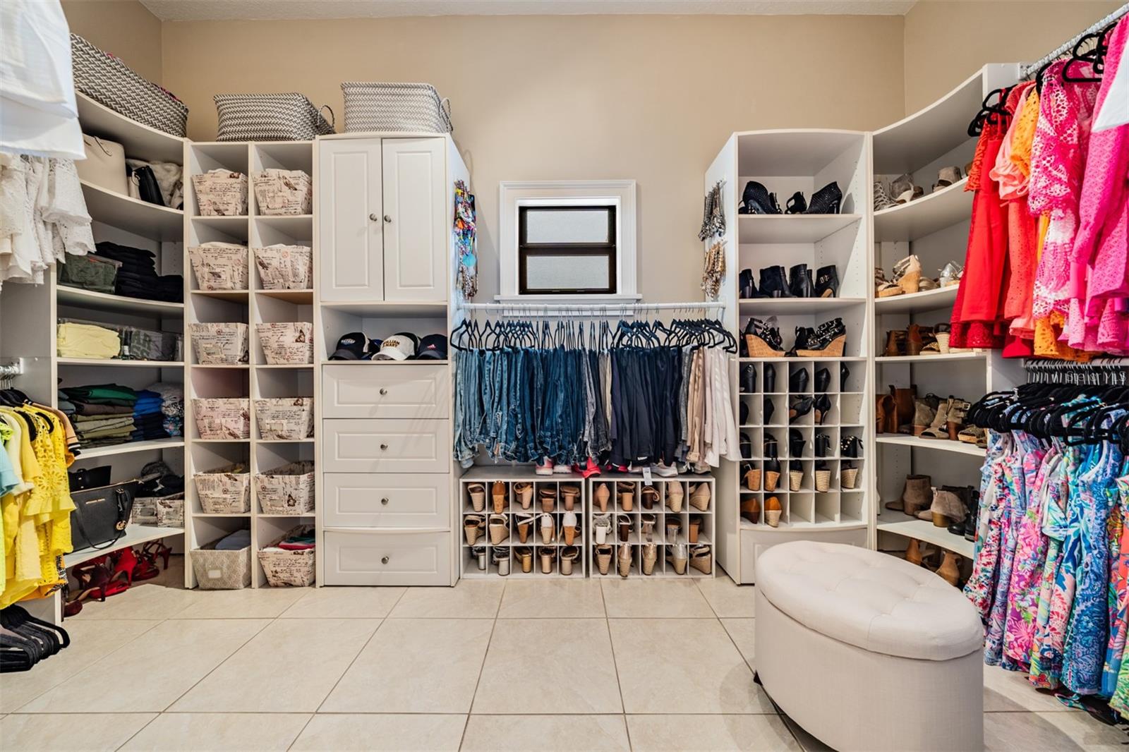 An enviable upgrade- the 14’x8’ walk-in closet with custom shelving that offers a boutique-style experience