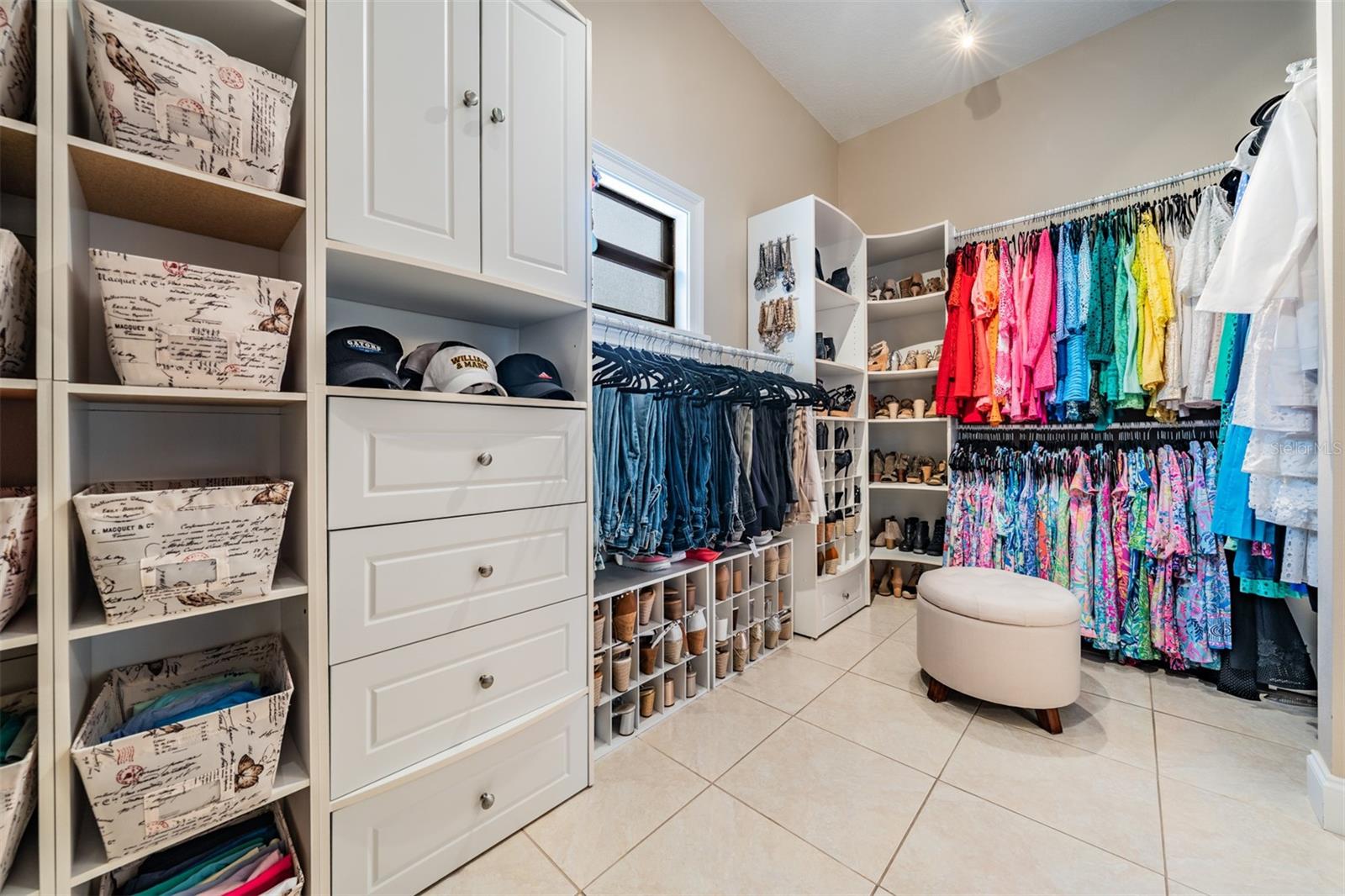 An enviable upgrade- the 14’x8’ walk-in closet with custom shelving that offers a boutique-style experience