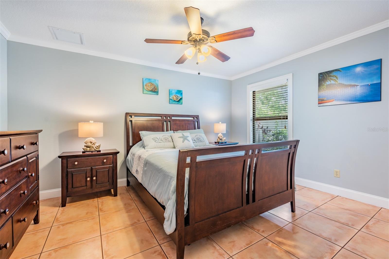 Located across from the primary suite, the fourth bedroom is perfect for guests or a nursery, boasting its own ensuite bath with stylish finishes and a convenient stand-up shower.