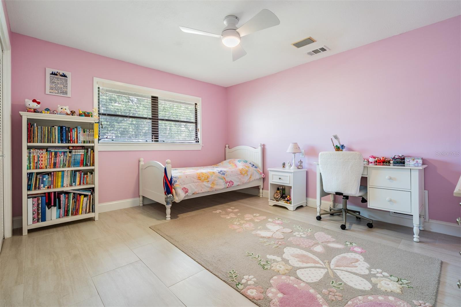 Third bedroom is a nice size with ceramic tile flooring, fresh paint, a wall closet and a modern fan