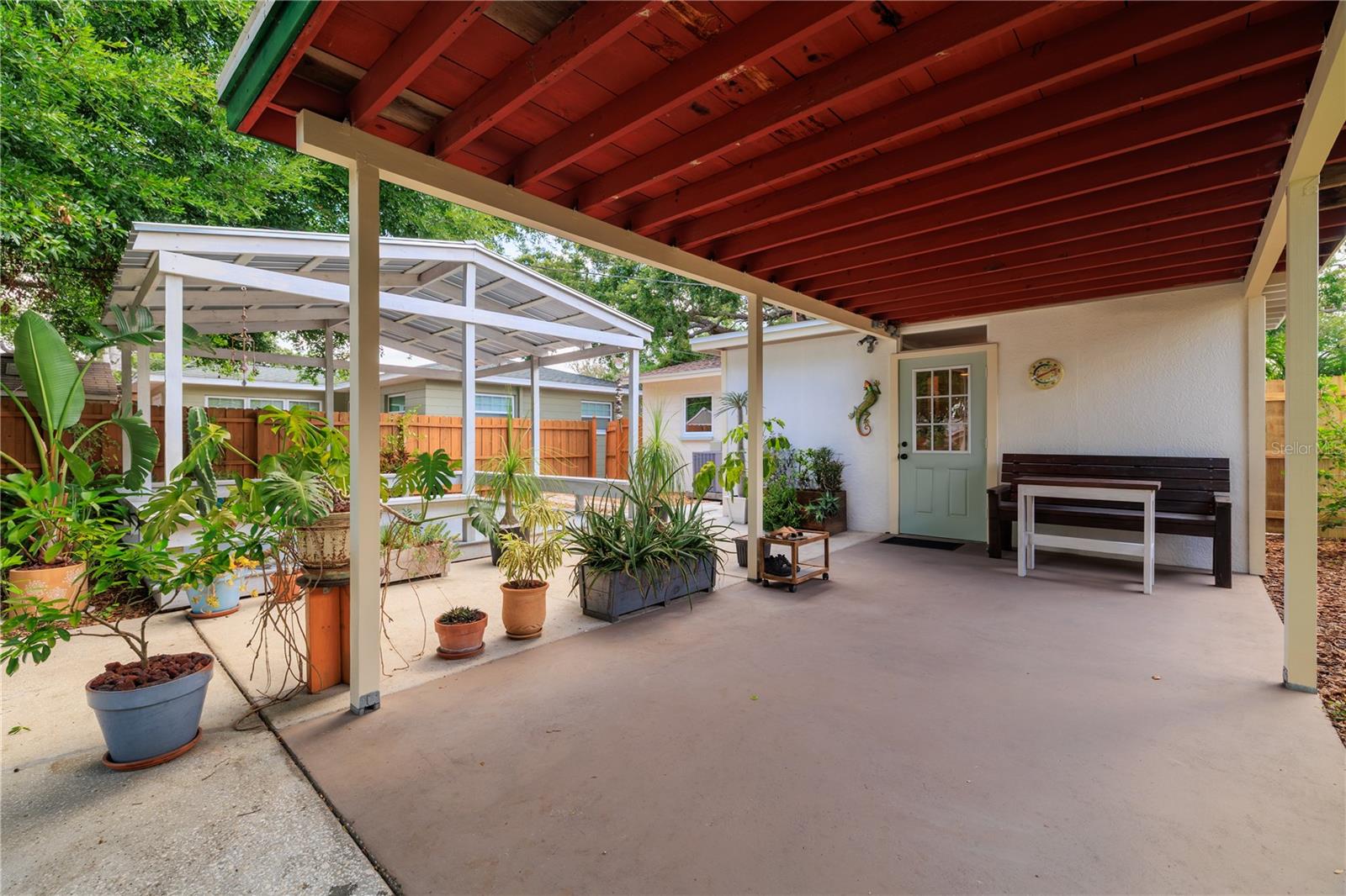 Covered carport space offers a place to park or hang out