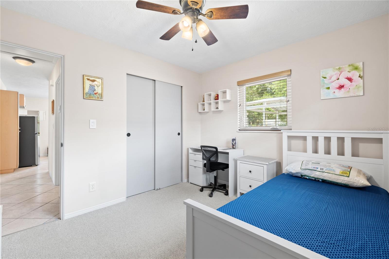Second bedroom is ample sized and has views of the backyard