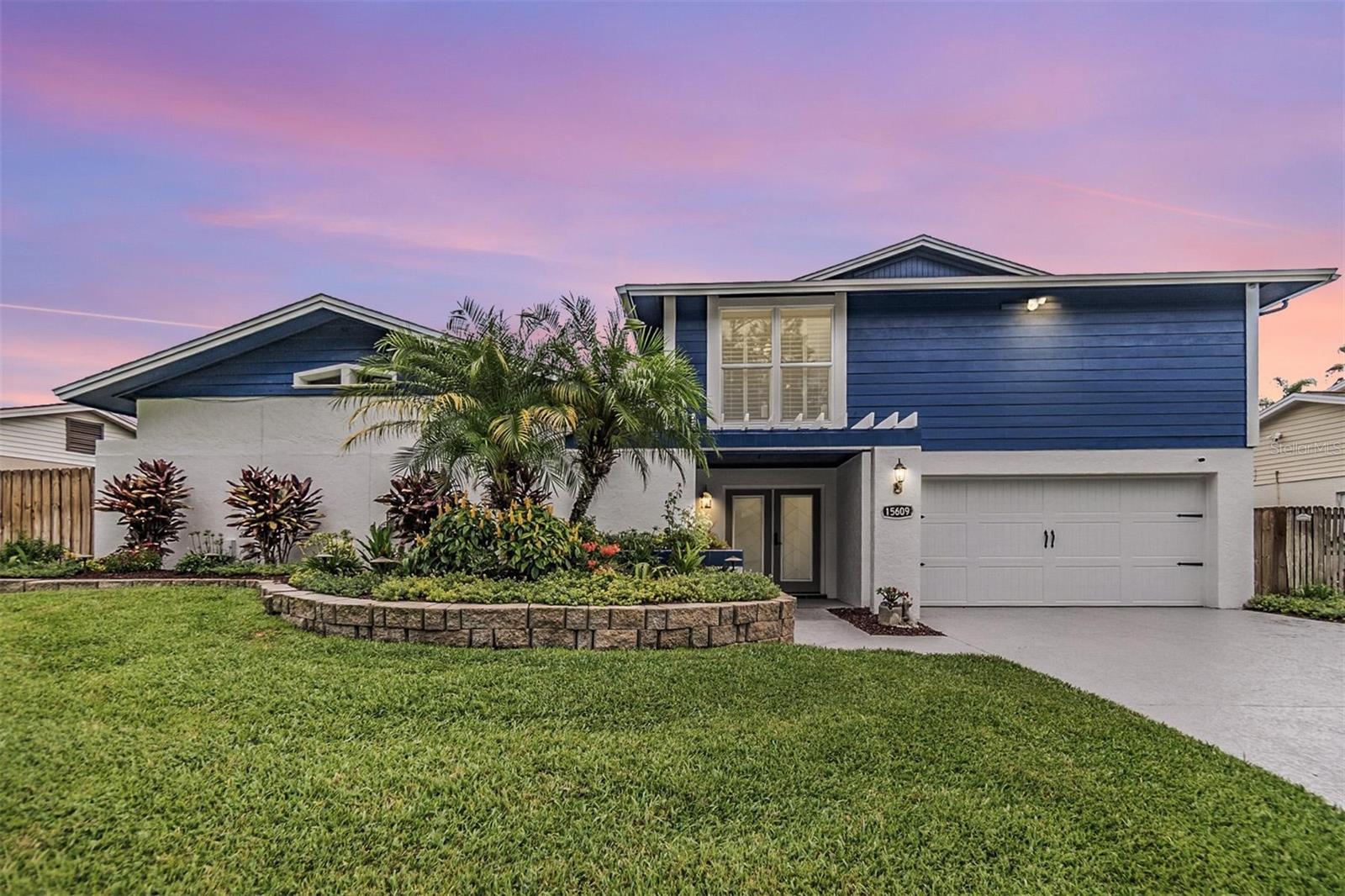 Fresh exterior paint and professional landscaping