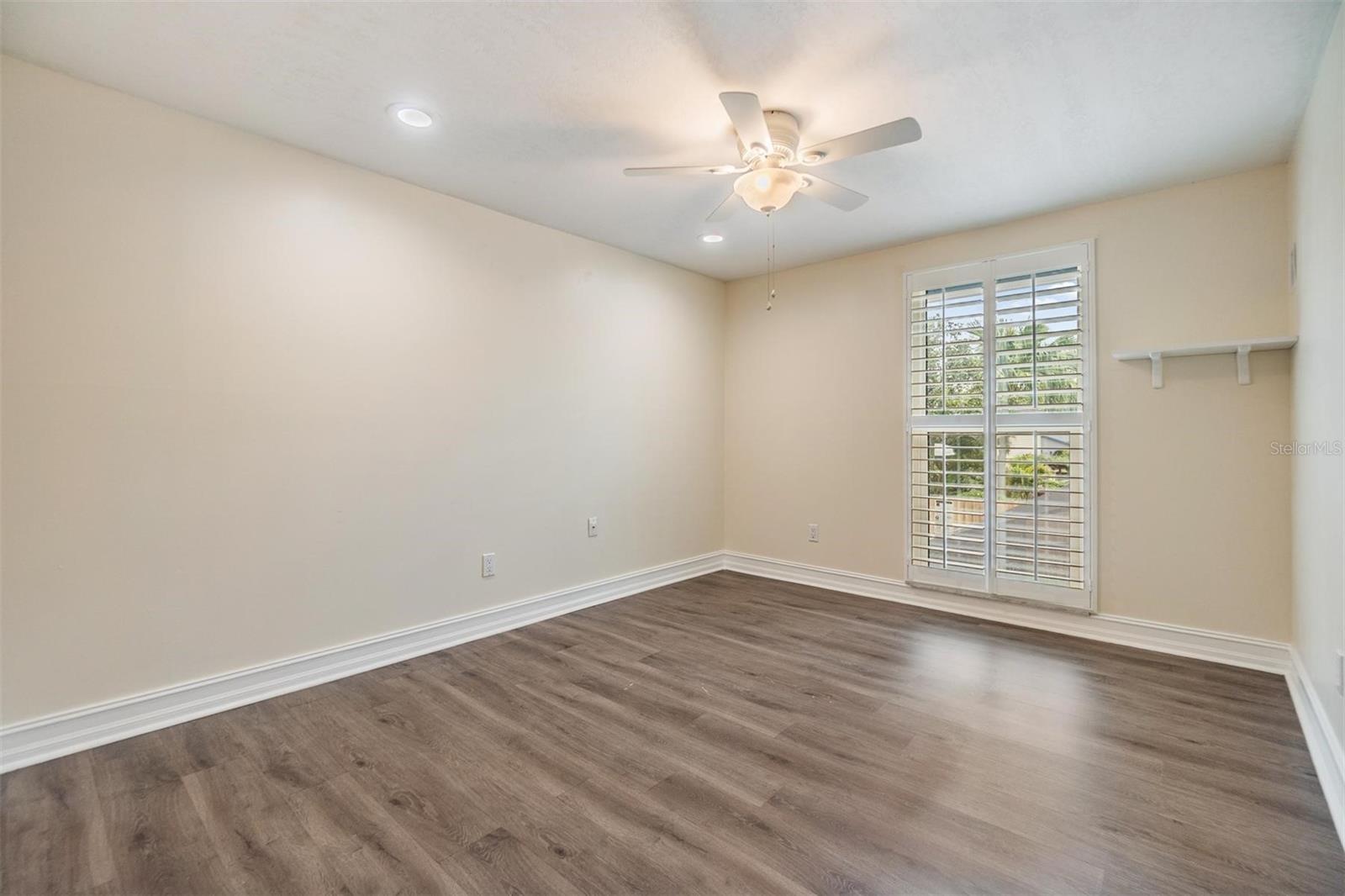 One of the other 3 bedrooms upstairs - notice the new plantation shutters