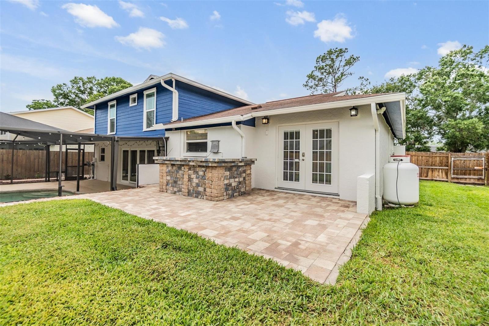 Backyard with area for outdoor grilling and entertaining!