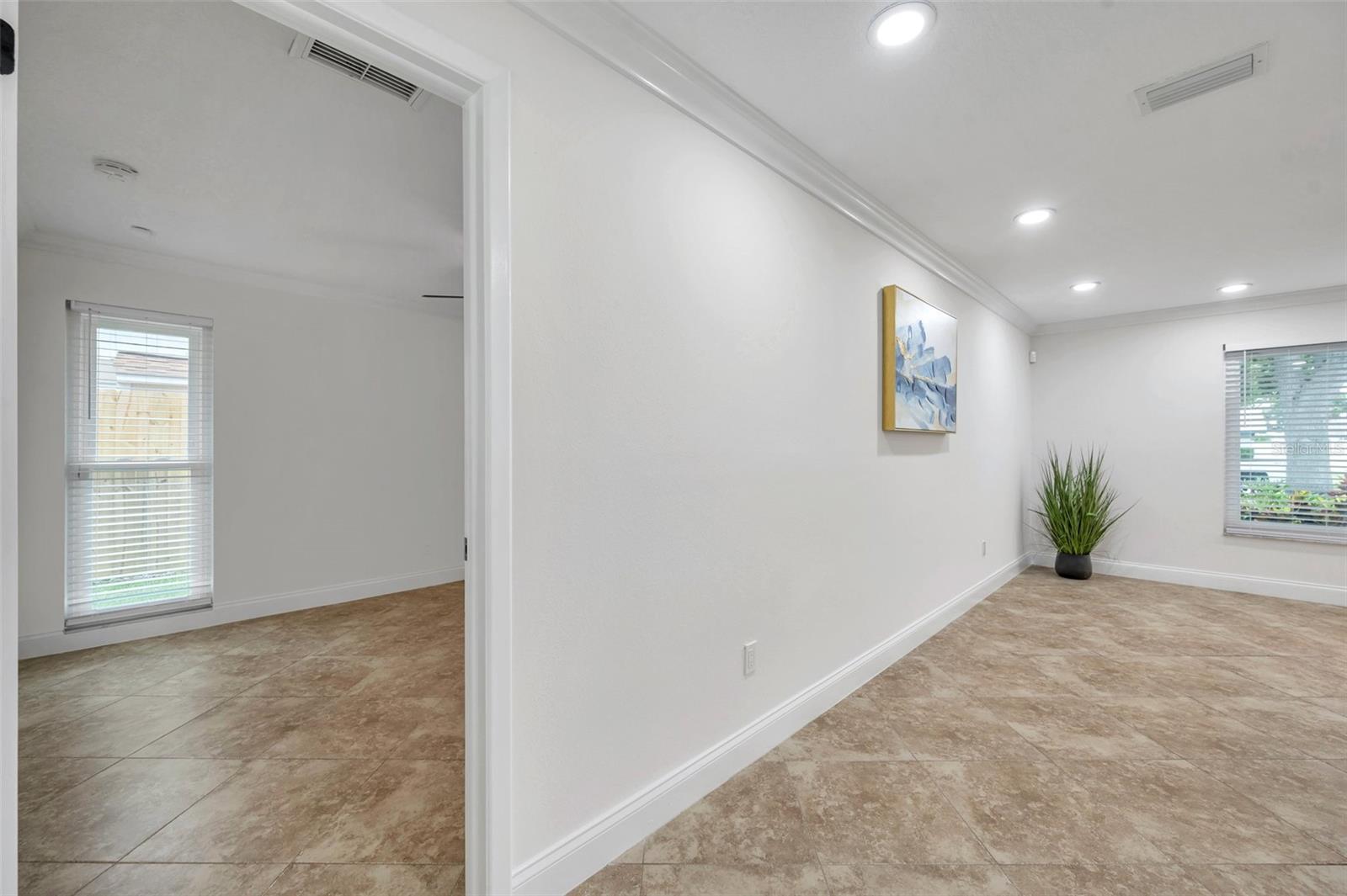 MASTER BEDROOM SUITE ON LEFT AND LIVING ROOM ON THE RIGHT LOOKING AT FRONT YARD FACING EAST.