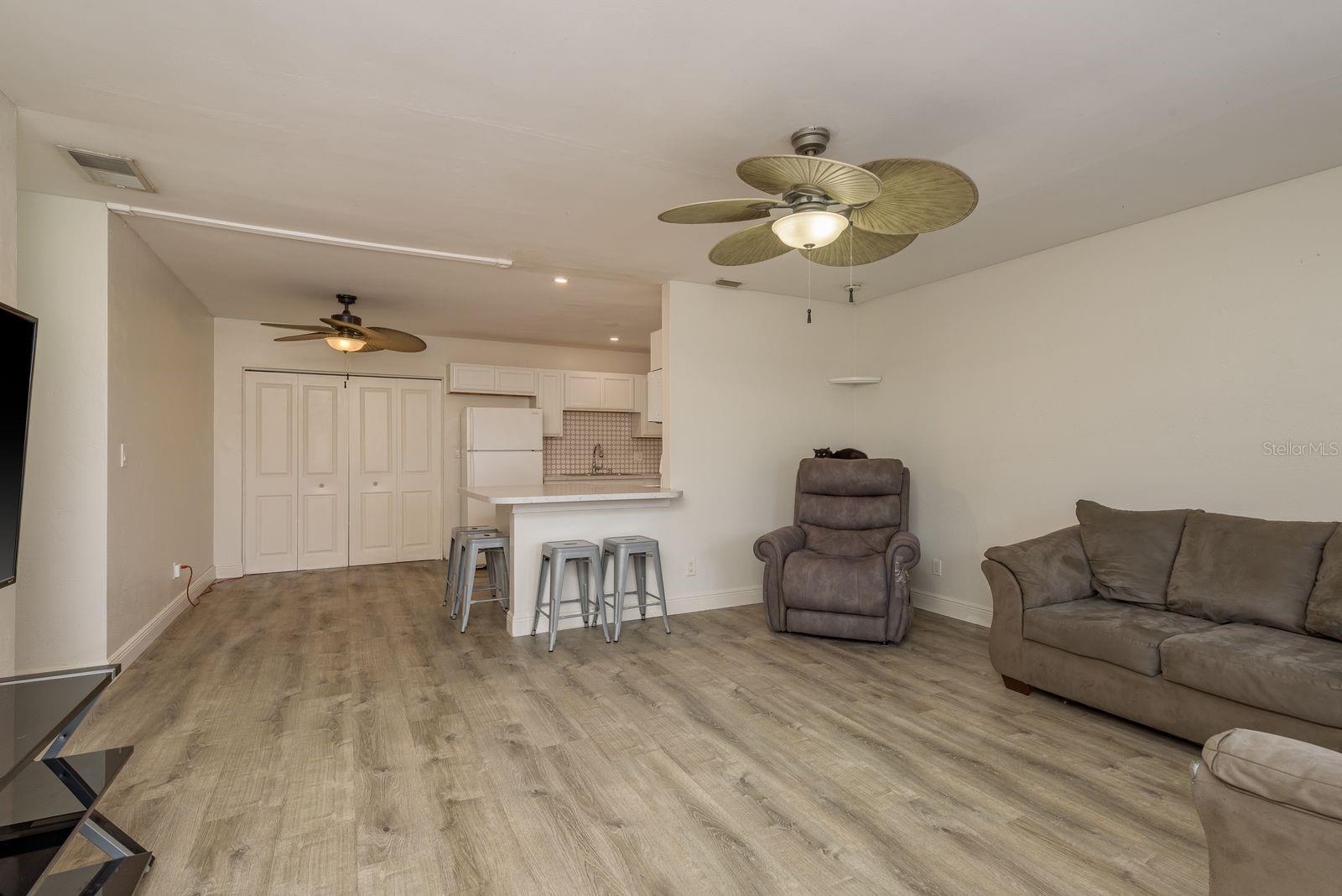 Open to the kitchen and dining room .