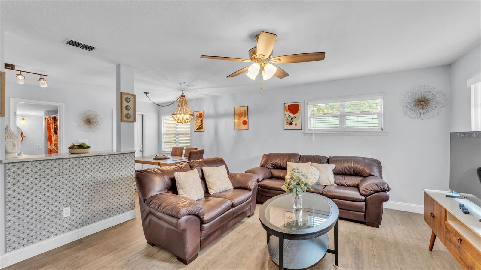 Living room with open layout leading to the kitchen