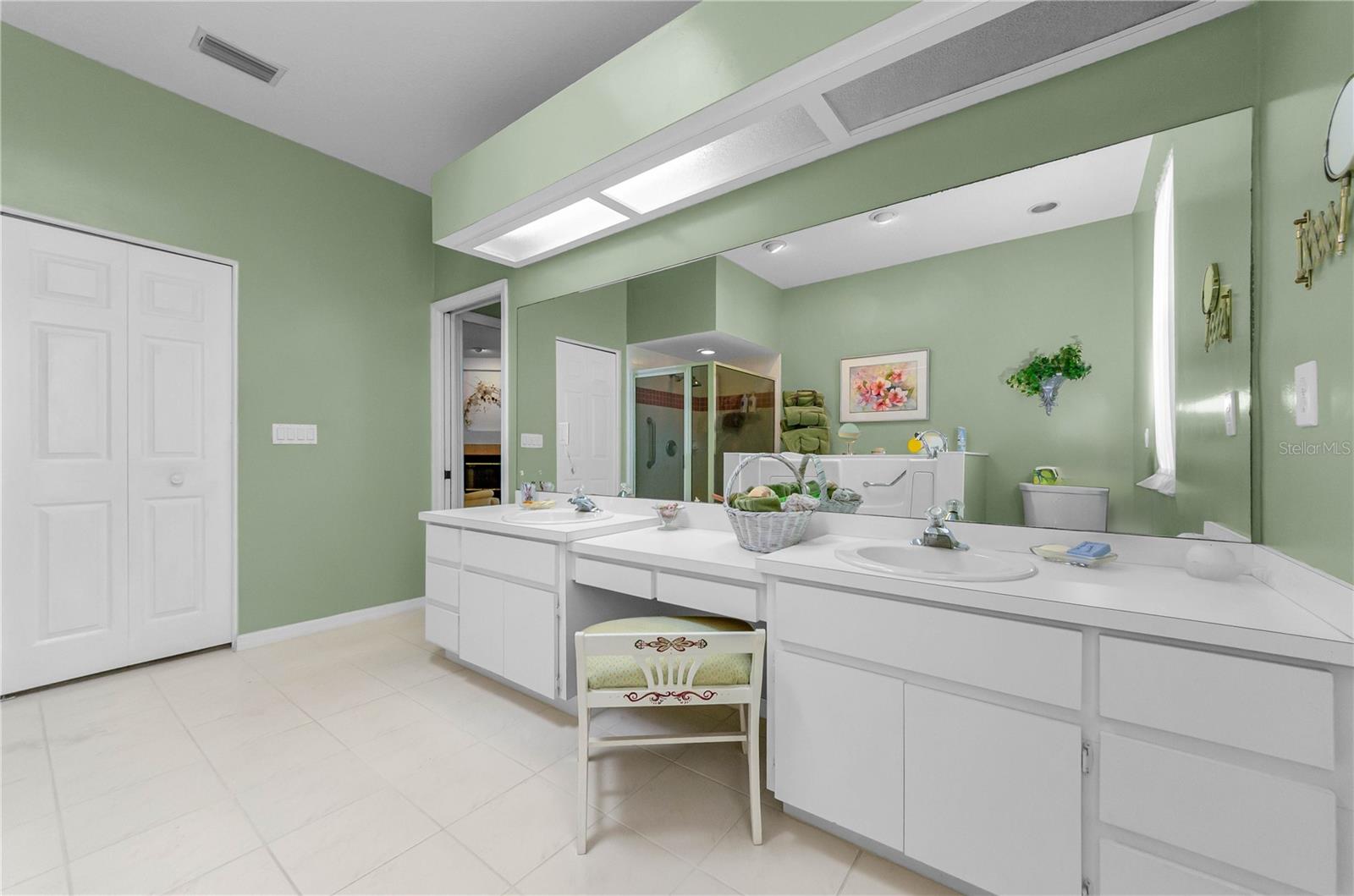 Primary bathroom with walk-in bathtub (25K) and separate shower, double sinks at counter and very large master closet.
