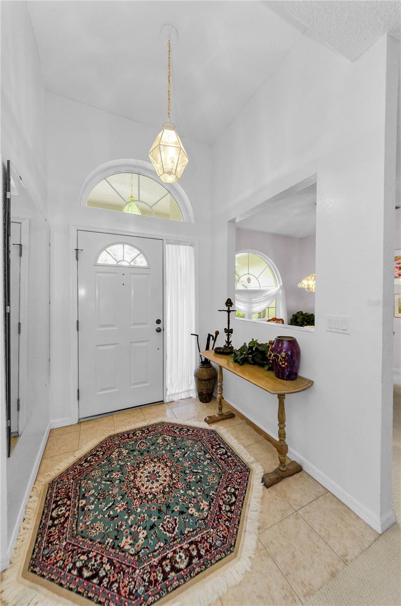 Foyer entrance with Coat closets & high ceilings throughout!