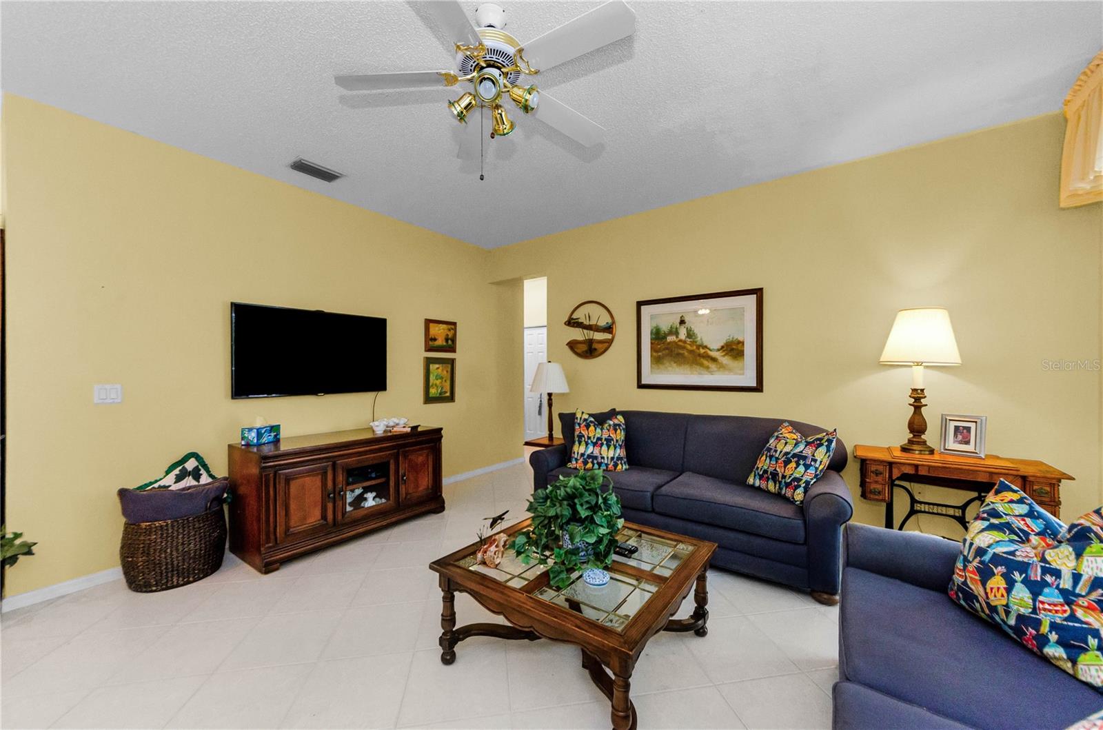 Family room with entrance to other 3 bedrooms and bath.
