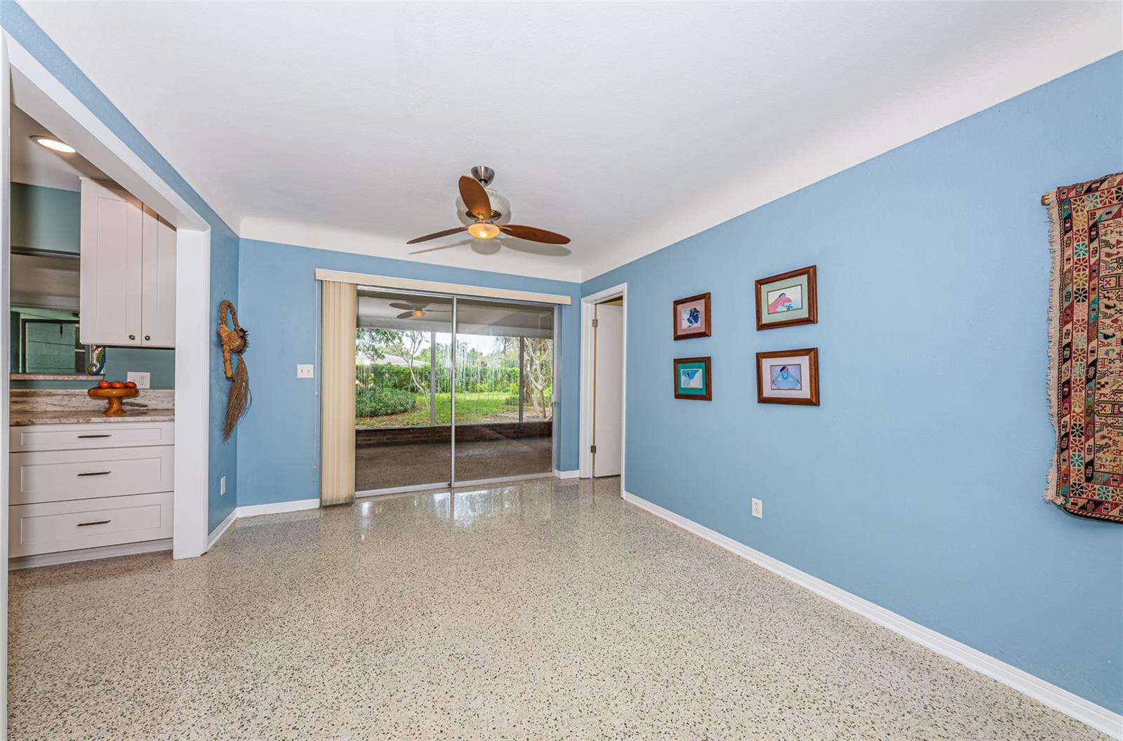 Dining room overlooking rear yard and screened lanai.