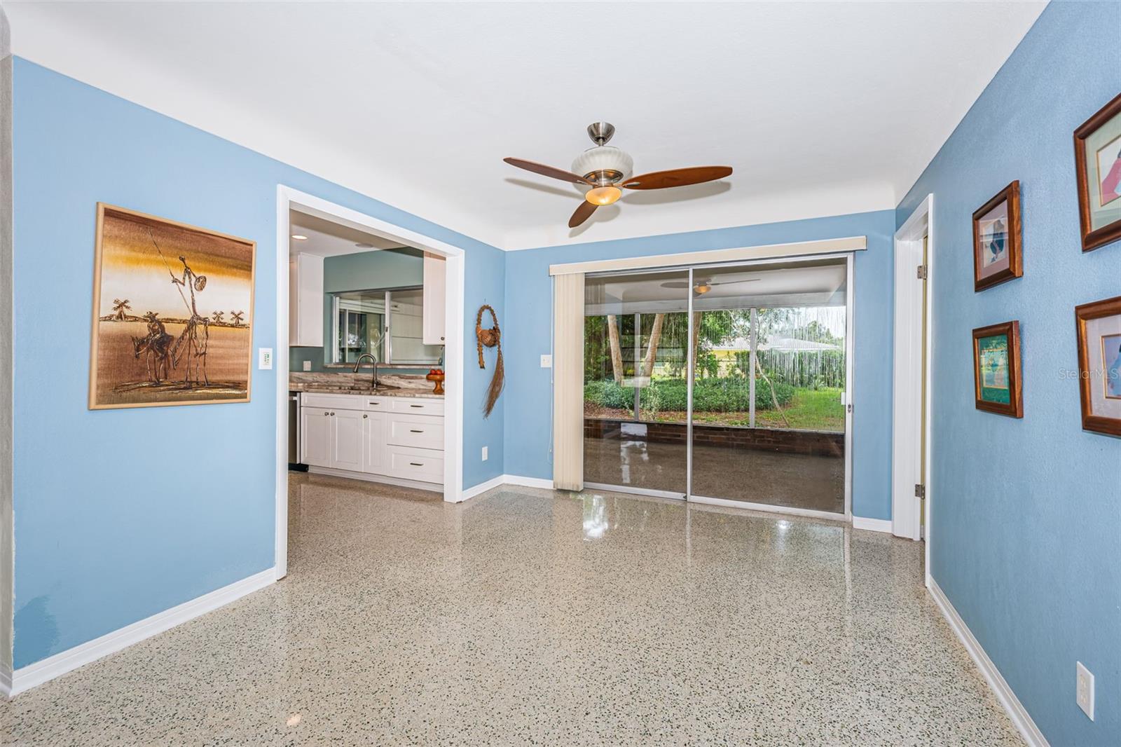 Dining room overlooking rear yard and screened lanai.