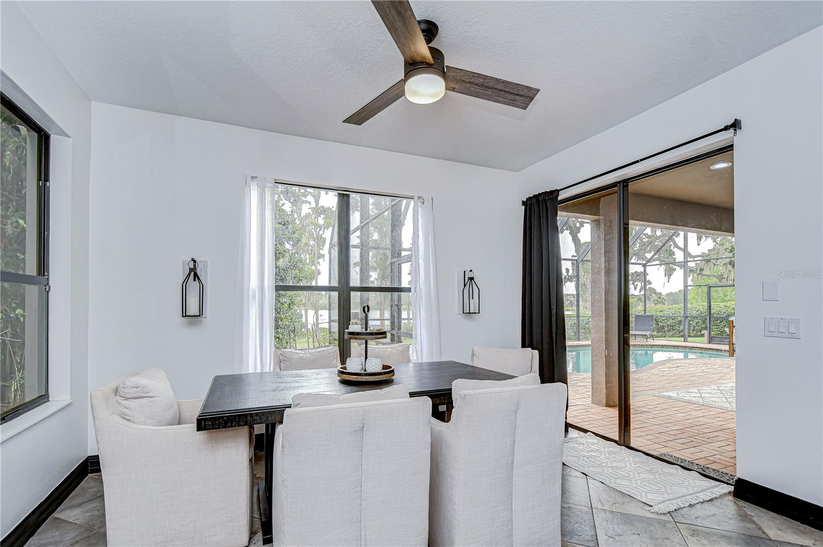 Kitchen features a bright breakfast nook—offering panoramic views of the backyard and water!